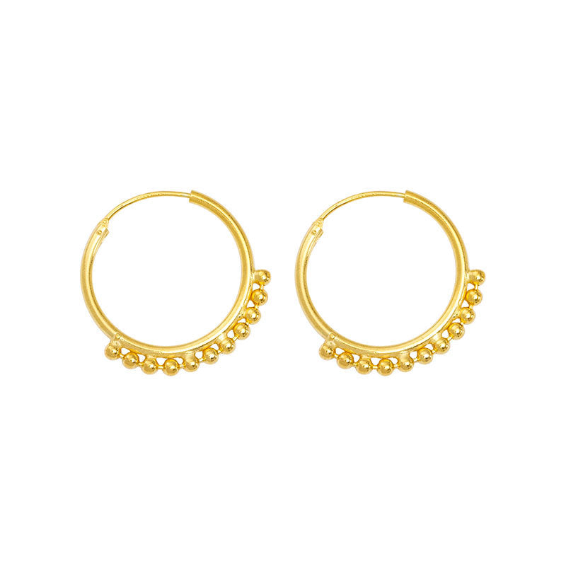 What are hoop earrings and why are they popular?